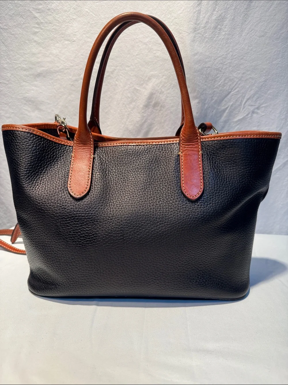Dooney & Bourke Black Pebbled Leather Tote with Brown Trim & Handles